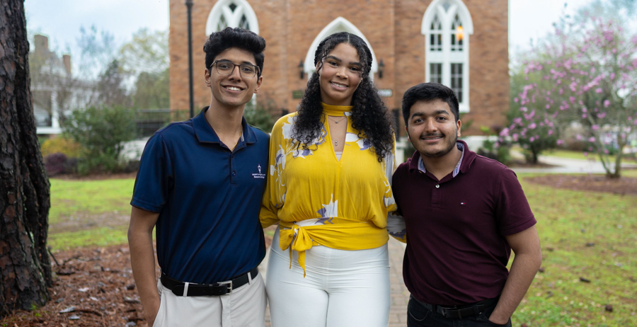 Three University of South Alabama Honor College students, from left, Suhas Patil, Kaitlyn Riggins and Dev Mehta, recently took third, second and first place in a competition for research posters at the Alabama Academy of Science Conference.