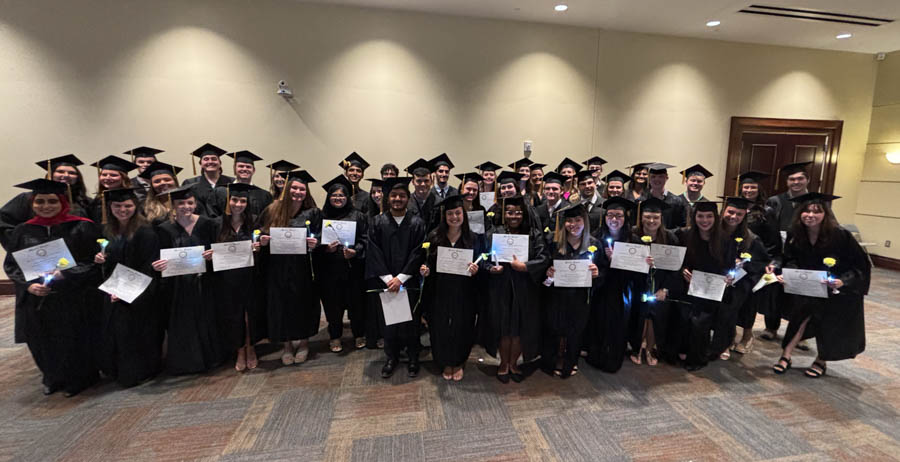 Mortar Board Receives National Award, Initiates New Members