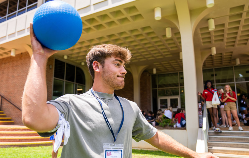 student throwing a ball