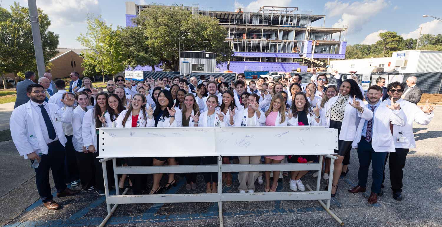 USA medical students after signing a structural beam for the Whiddon College of Medicine