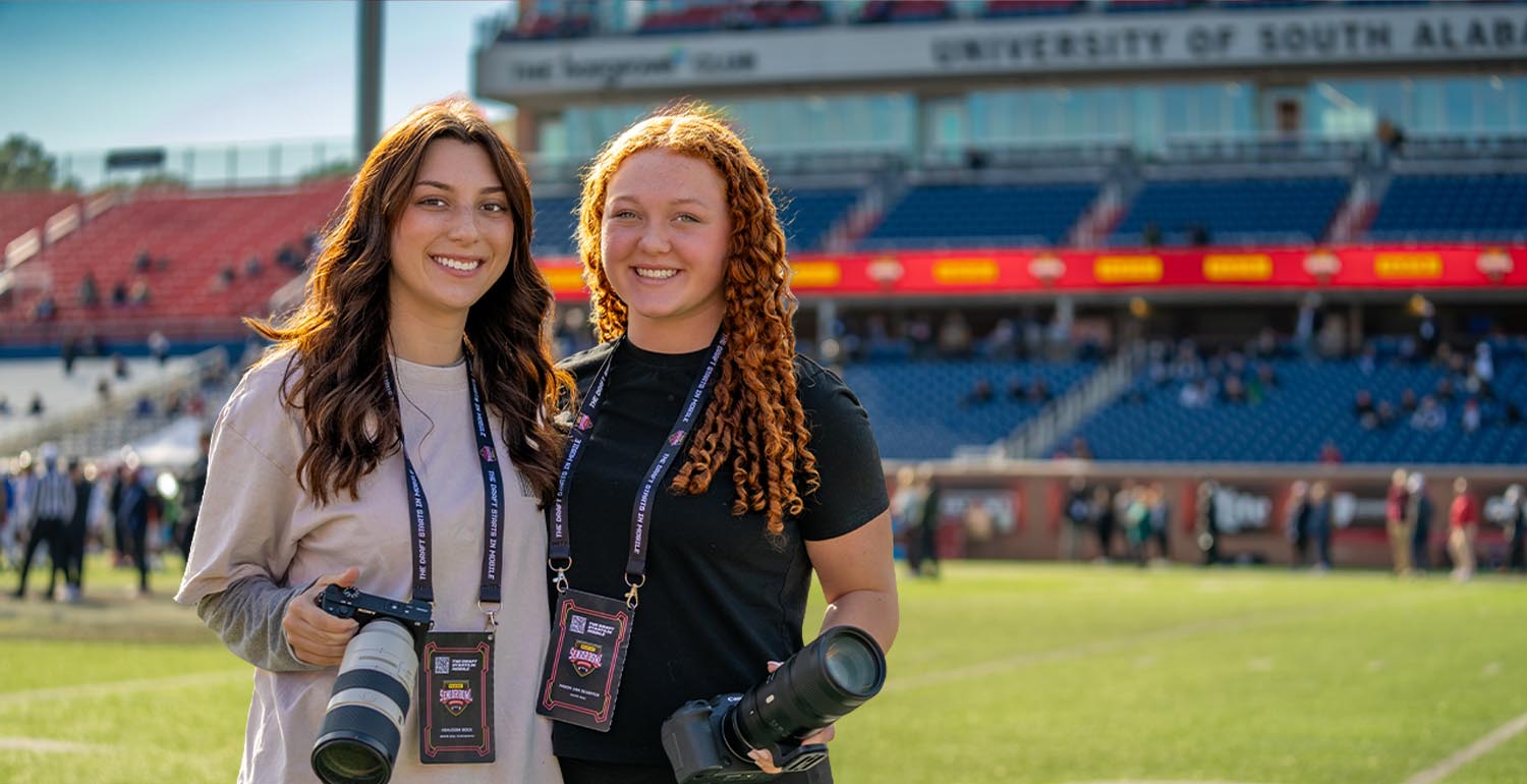 Mason Van Deventer, a freshman majoring in sport management, captures photos at a Senior Bowl practice at Hancock Whitney Stadium on the University of South Alabama campus. data-lightbox='featured'