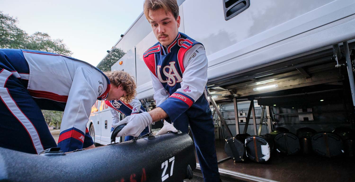 Band members unloading the bus