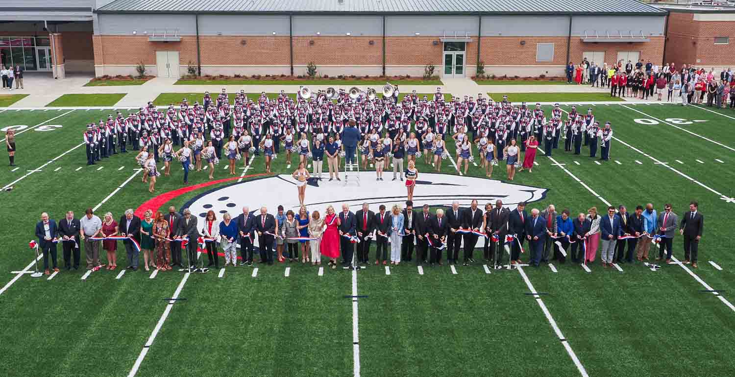 The Jaguar Marching Band and others at the ribbon cutting