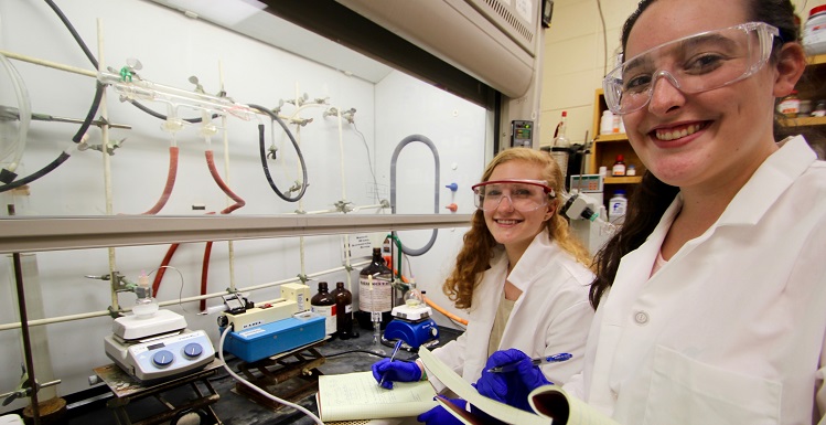 Alabama School of Mathematics and Science students Amanda Peterson, left, and Anna Wright have spent the fall working as research collaborators in Dr. David Forbes’ laboratory in USA’s chemistry department.  