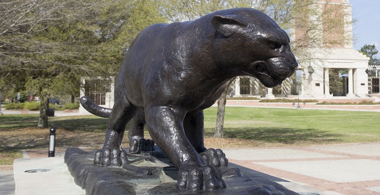 close-up of bronze statue of Jaguar in Moulton Tower plaza