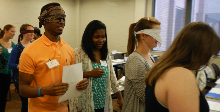 Bedsole Foundation Scholars take part in trust-building exercise during a leadership seminar session at the USA Mitchell College of Business.