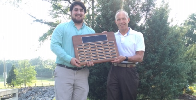 USA sophomore David Zakrzewski, left, is a recipient of the Davis Leadership Award, established in 2000 by Judge Don Davis, right, and Dr. Beth Davis.