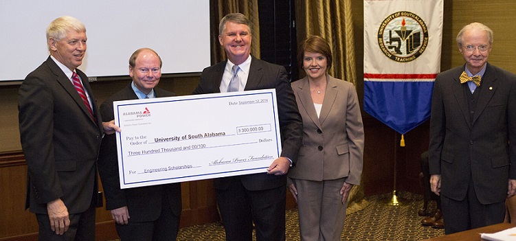 Alabama Power representatives present a check to the University of South Alabama to establish a scholars program in the College of Engineering. From left, USA President Dr. Tony Waldrop; Dr. Steven Furr, chair pro tempore of the USA Board of Trustees; Mike Saxon, Alabama Power vice president of the Mobile division; Beth Thomas, Alabama Power external affairs manager; and Abraham Mitchell, who will match the gift through the Mitchell-Moulton Scholarship Initiative. 