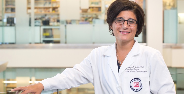 Jennifer Scalici, a gynecologic oncologist with the University of South Alabama’s Mitchell Cancer Institute, leads an MCI team partnering with Auburn’s poultry science department to determine if a compound developed inside the Mobile center can successfully prevent ovarian cancer in hens.