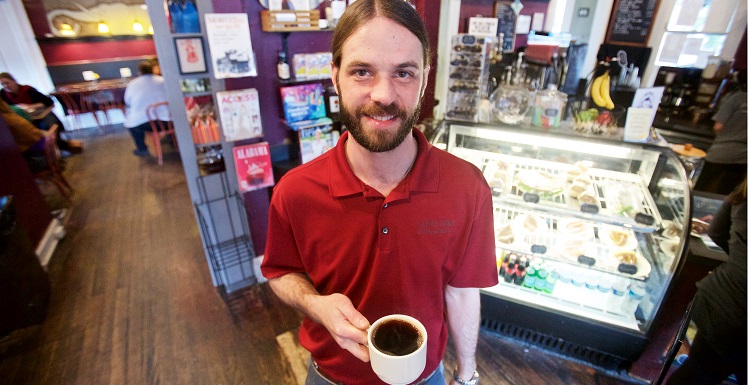 Alan Tolson, a business graduate and owner of Carpe Diem Coffee & Tea Co., said the Springhill coffee house is experiencing double-digit growth. One emerging sector: Churches looking to provide parishioners with coffee before or after service. 