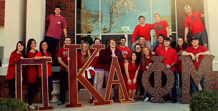 Members of Pi Kappa Alpha and Phi Mu participate in National Wear Red Day at the University of South Alabama. 