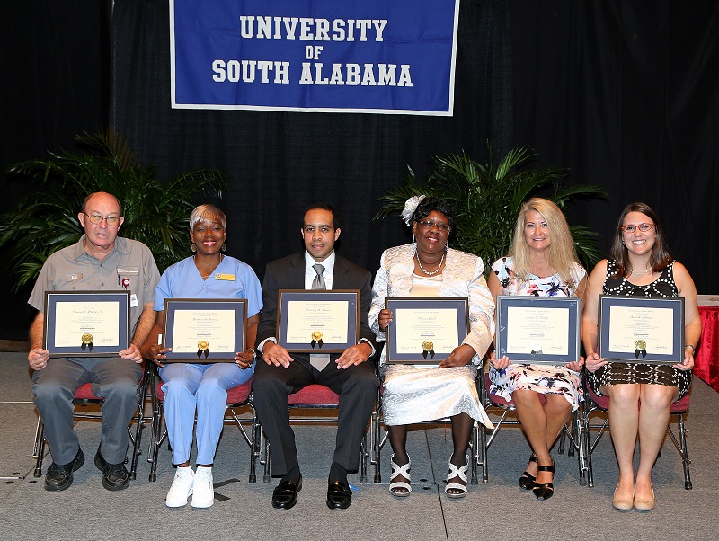 Six University employees are recipients of the 2014 Christie Miree USA National Alumni Association Outstanding Employee Award. These employees, selected from among USA-Team recipients, were recognized for excellent service provided to students, alumni and other constituencies. They are, from left, Deward C. Phillips Jr., maintenance mechanic II, facilities management, USA Medical Center, craft/trades category; Patricia A. Young, custodial worker II, student center, service category; Timothy X. Dexter, assistant director, supply, processing and distribution, Children’s & Women’s Hospital, technical category; Theresa Clark, ward clerk, high risk OB, Children’s & Women’s Hospital, clerical category; Angela S. Duffy, nurse manager, burn center, USA Medical Center, administrative category; and Anna K. Gillman, RTN III, STICU, USA Medical Center, professional category.