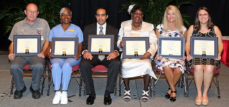 Six University employees are recipients of the 2014 Christie Miree USA National Alumni Association Outstanding Employee Award. These employees, selected from among USA-Team recipients, were recognized for excellent service provided to students, alumni and other constituencies. They are, from left, Deward C. Phillips Jr., maintenance mechanic II, facilities management, USA Medical Center, craft/trades category; Patricia A. Young, custodial worker II, student center, service category; Timothy X. Dexter, assistant director, supply, processing and distribution, Children's & Women's Hospital, technical category; Theresa Clark, ward clerk, high risk OB, Children's & Women's Hospital, clerical category; Angela S. Duffy, nurse manager, burn center, USA Medical Center, administrative category; and Anna K. Gillman, RTN III, STICU, USA Medical Center, professional category.