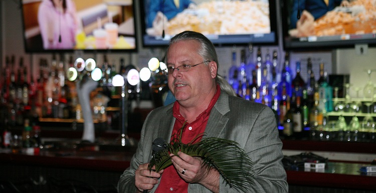 Dr. Brian Axsmith, a University of South Alabama professor of biology, speaks at his presentation, "It Ain’t Easy Seeing Green: Preventing Plant Blindness," held Tuesday at the OK Bicycle Shop.