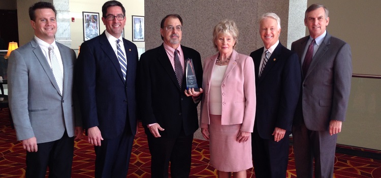 USA's Coastal Innovation Hub received the 2014 Innovator of the Year Award from the Mobile Area Chamber of Commerce on Friday, Nov. 21, 2014. From left, are Dr. Andrew Byrd, marketing and licensing associate with USA's Office of Intellectual Property Management; Chamber President Bill Sisson; Dr. Mark Weaver, director of the Coastal Innovation Hub; Lynne Chronister , USA vice president for research and economic development; Michael Chambers, Chamber chairman of the board; and Ker Ferguson, USA assistant vice president for research and economic development. 