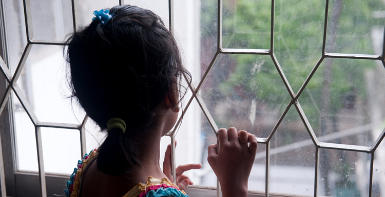 girl looking out of window