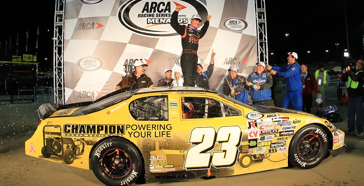 Grant Enfinger, who holds a marketing degree from USA, celebrates at Kansas Speedway in October after winning the 2015 ARCA Racing Series championship. 