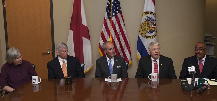 University President Tony G. Waldrop speaks during Mayor Sandy Stimpson's news conference on local universities teaming up with the City of Mobile to promote service learning.  From left, Samantha Church, associate vice president for advancement, Spring Hill College; Dr. Mark Foley, president, University of Mobile; Stimpson; Waldrop; and Dr. James Lowe, president, Bishop State Community College.