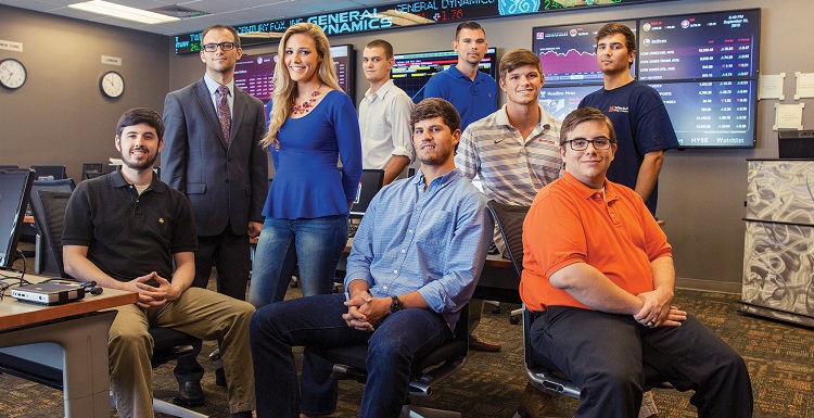 Dr. Kyre Lahtinen, standing top left, is an assistant professor of finance and the faculty advisor to the Jaguar Investment Fund. Participating students for the first semester were, from left, Tyler Yakola, Charis Singleton, Micah Calhoun, Harrison Spruiell, James Lewis, Hayden Welford, Britton Hall and Nicholas Blakley. 
