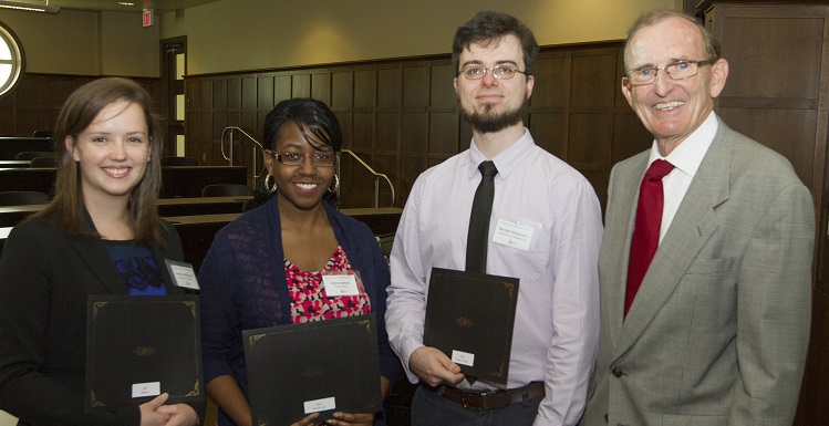 Winners were announced from USA's 2nd Annual 3MT® Competition held Wednesday, March 18. They are, from left, Lindsey Whitehurst, computer science; runner-up Selena Jackson, psychology; and Peoples? Choice Winner Michael Hempowicz, mechanical engineering. They are congratulated by Dr. B. Keith Harrison, dean of the Graduate School and associate vice president for academic affairs.