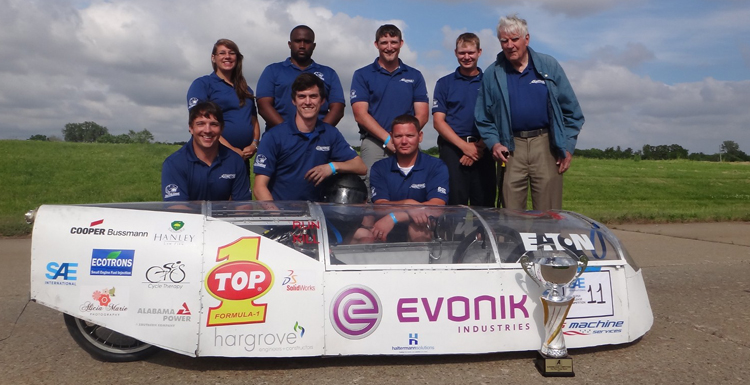 Members of USA’s team in the 2015 SAE Supermileage Competition display their Design Report Trophy. Shown, front row from left, Chris Hanley, senior, mechanical engineering; Brandon Troub, senior, mechanical engineering; Daniel Mooney, junior, mechanical engineering; back row from left, Lisa Schibelius, senior, mechanical engineering; Taurean Mulkey, sophomore, computer engineering; Ethan Anderson, junior, mechanical engineering; Dalton Dennis, junior, mechanical engineering; Dr. Frances Donovan, faculty advisor, SAE. Team members not showed: Taylor Gwin, senior, mechanical engineering; Glynn Davies, senior, mechanical engineering; Christian Cobb, senior, mechanical engineering; Patrick Rohr, junior, electrical engineering; Christoph Graf, graduate student, communications; Kristen Gilman, senior, accounting.