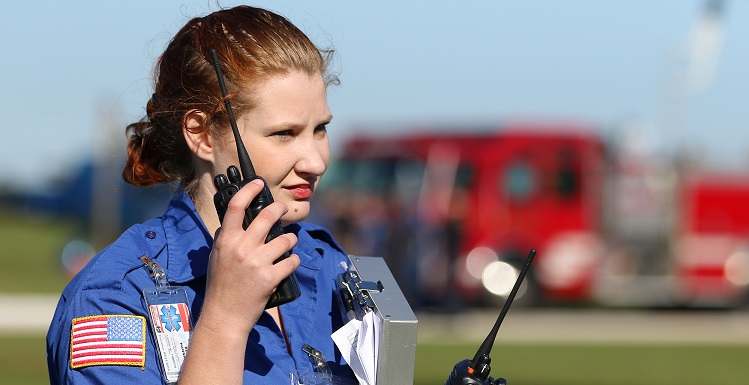 Hannah Beals, a senior in the USA emergency medical services program, listens to radio reports during a disaster drill at Battleship Memorial Park on Nov. 19. Students from the emergency medical services program, the physician assistants program, nursing and the College of Medicine participated in the scenario.