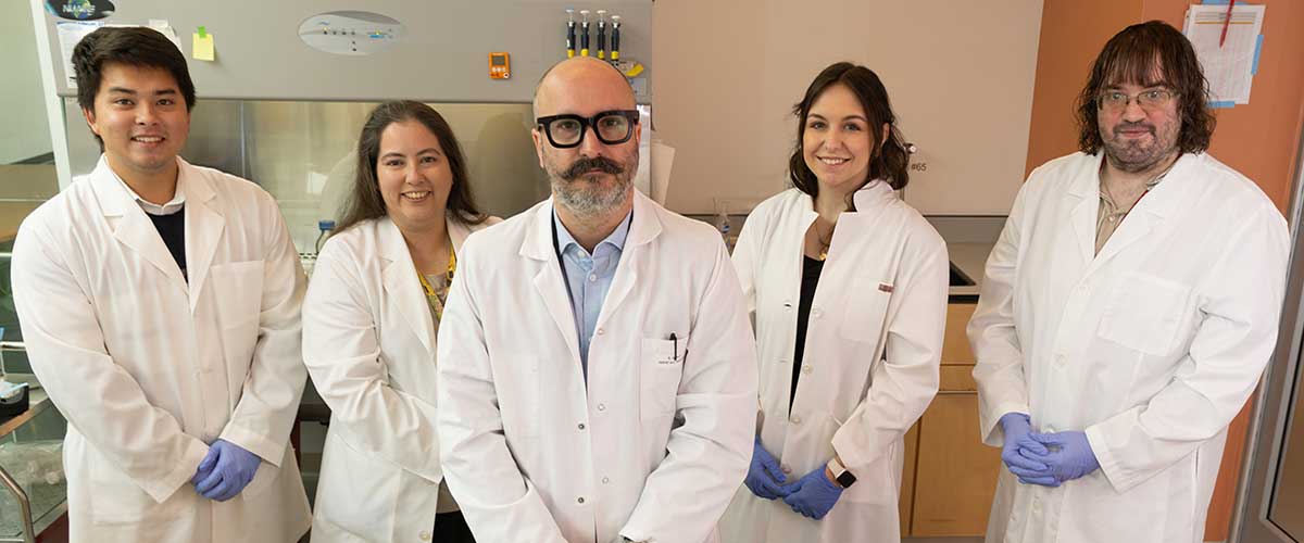 USA researcher Simon Grelet, Ph.D., center, is shown with members of the Cancer Innervation and Neurobiology Laboratory at the USA Health Mitchell Cancer Institute in Mobile, Alabama. data-lightbox='featured'