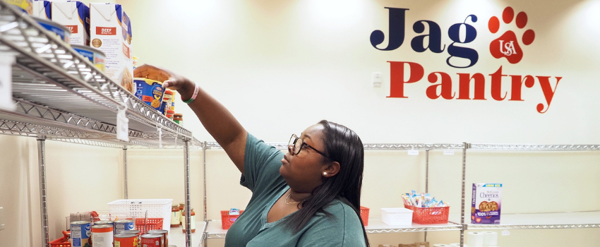 Student stocking food in JagPantry.