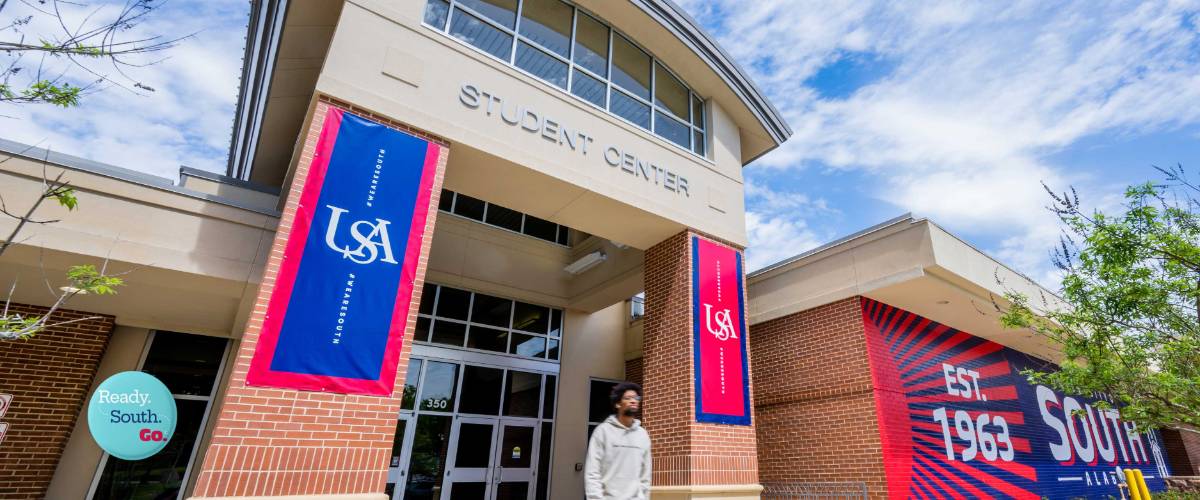 Student walking out of the Student Center.