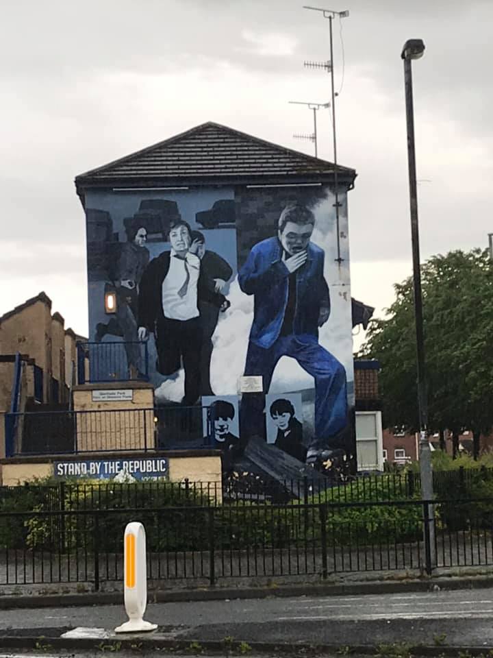 Paitning of men running with suits on