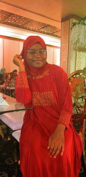 Student at wedding in red dress