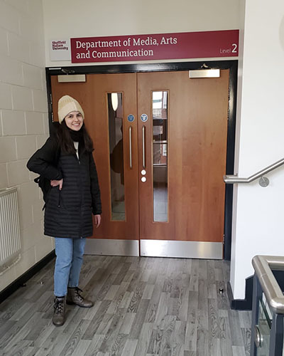 Woman Standinf in Doorway