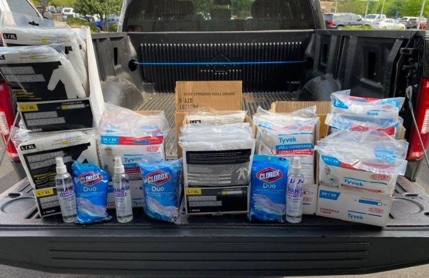 meals, snacks, PPE and supplies in bed of a pick-up truck