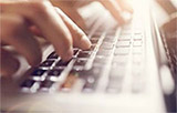 close-up of hands on keyboard