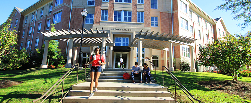 Students walking out of the front of stokes hall