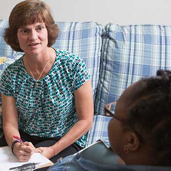 A counselor working with a patient.