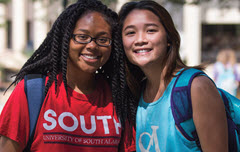 TWo female students in South shirts smiling
