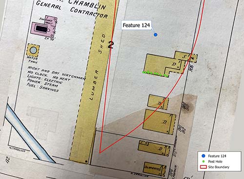 The 1915 Sanborn Fire Insurance Map with features from the 2022 archaeological excavations. The row of post holes is in green, while Feature 124, a large trash pit, is in blue. The “D” on the structure stands for “dwelling,” while “S” stands for “store.” 1915 Sanborn Map courtesy of the Mobile Municipal Archives.