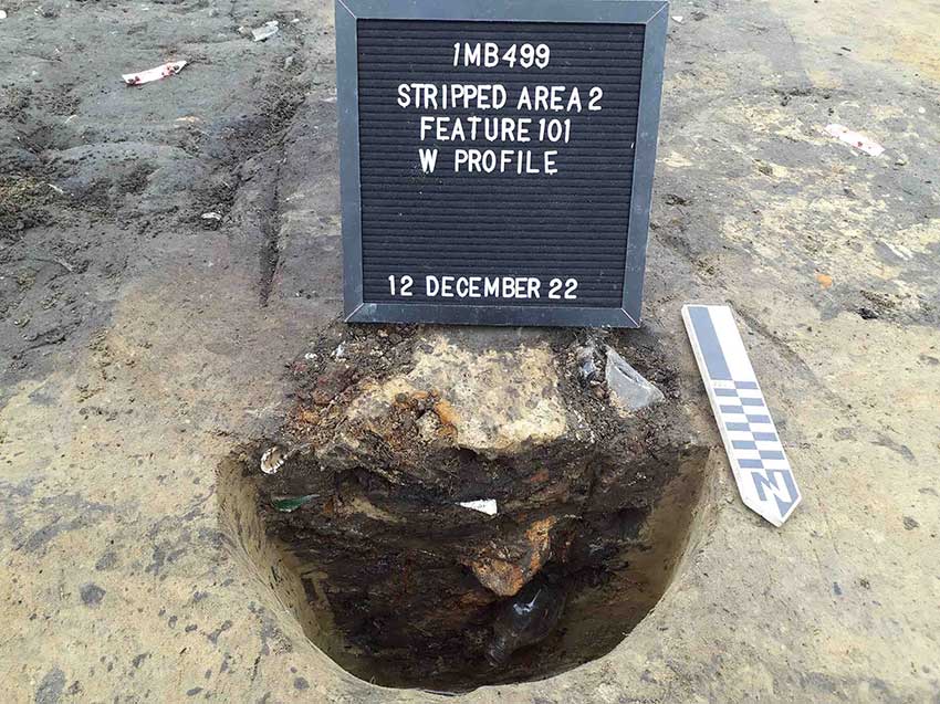 A hole containing brick fragments and bottle glass 