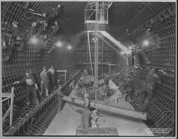 Workers inside the interior tube of the Bankhead Tunnel. Taken in 1939 during tunnel construction.