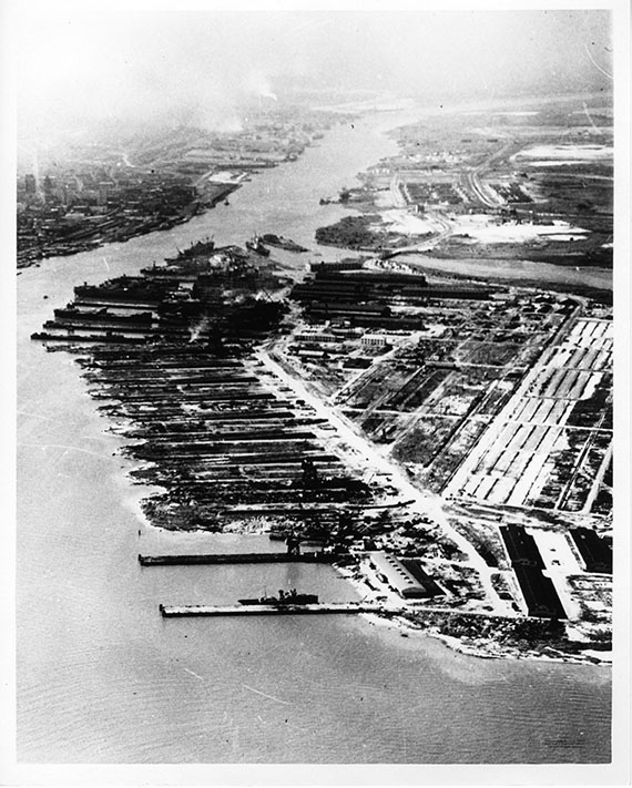 An aerial view of the ADDSCO shipyards in the 1940s. Downtown Mobile and the north part of Down the Bay can be seen in the top left of the photograph.  Alabama Dry Dock and Shipbuilding Collection, The Doy Leale McCall Rare Book and Manuscript Library, University of South Alabama.
