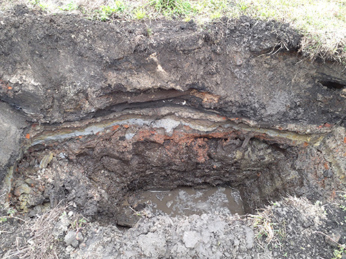 Test unit at the Eslava Street Site showing layers of deposition. 