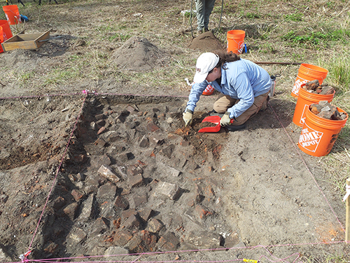 An archaeologist excavating a site for the I-10 Mobile River Bridge Archaeological Project.
