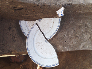 Two halves of a French faience plate 