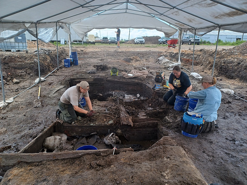 archaeologists finding artifacts deep in the ground