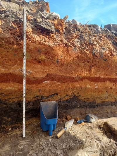 Soil layers from the I-10 Mobile River Bridge Archaeology Project. The orange and red layers are clay fill that was brought in during the construction of I-10.