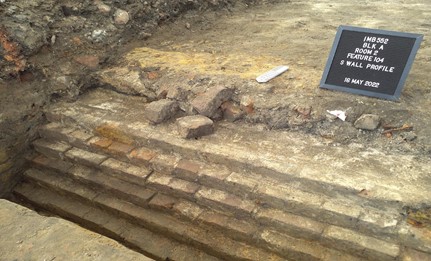 buried remnants of the tenement brick walls