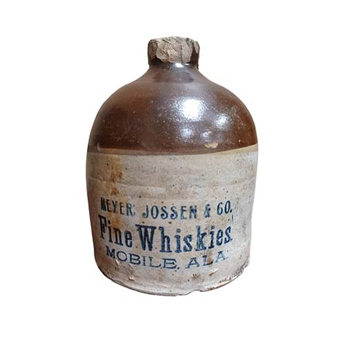 A stoneware whiskey jug labeled Meyer, Jossen & Co. Fine Whiskies, Mobile Ala. Excavated by archaeologists from Feature 124. 