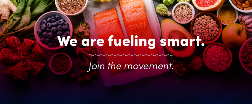Fruit and fish on a table with the words We are fueling smart. Join the movement overlay on top.