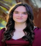 A headshot portrait of Riley Lee